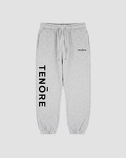 Light heather gray sweatpants with a black vertical TENORE logo printed on the left leg and a small black TENØRE logo on the right hip.